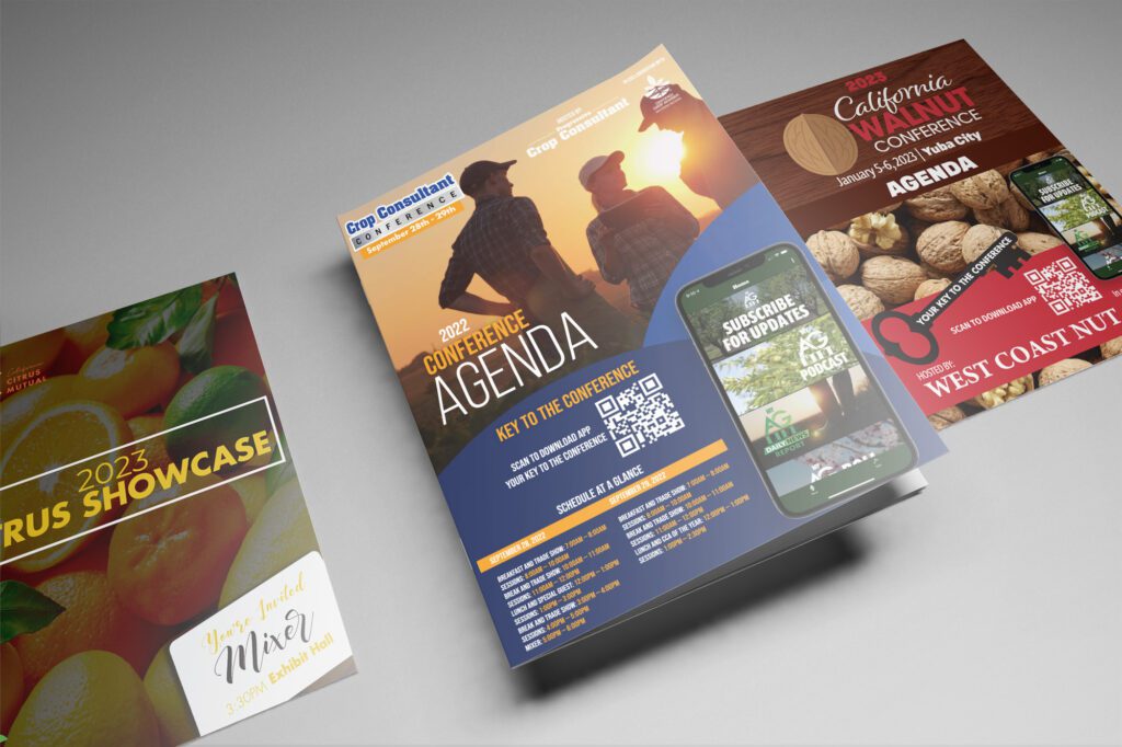 A mockup of several conference brochures